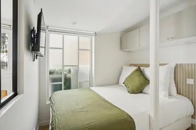 Un ou plusieurs lits dans un hébergement de l'établissement Lavie Maison AC and Terrace