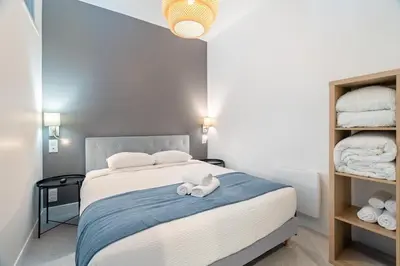 Un ou plusieurs lits dans un hébergement de l'établissement Charmant appartement 6 couchages