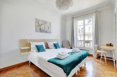 Un ou plusieurs lits dans un hébergement de l'établissement Modern Apartment - 2BD 4P - Louvre Marais