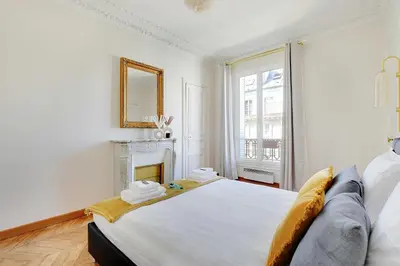 Un ou plusieurs lits dans un hébergement de l'établissement Modern Apartment - 2BD 4P - Louvre Marais