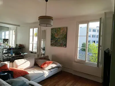 Coin salon dans l'établissement Appartement idéal pour visiter Paris
