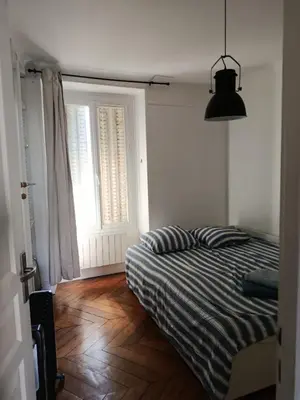 Un ou plusieurs lits dans un hébergement de l'établissement Appartement idéal pour visiter Paris