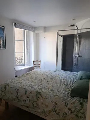 Un ou plusieurs lits dans un hébergement de l'établissement Appartement idéal pour visiter Paris