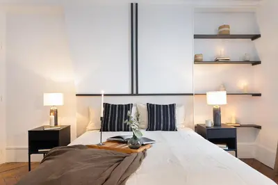 Un ou plusieurs lits dans un hébergement de l'établissement Germain - 1 chambre à Jardin des Plantes