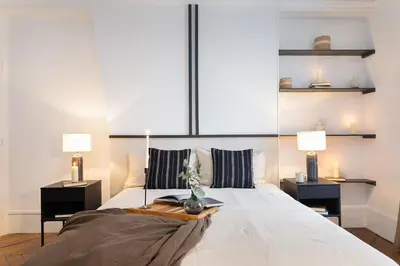 Un ou plusieurs lits dans un hébergement de l'établissement Germain - 1 chambre à Jardin des Plantes