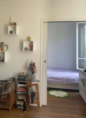 Un ou plusieurs lits dans un hébergement de l'établissement Notre appartement vue sur les Buttes Chaumont