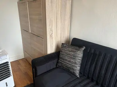 Coin salon dans l'établissement Family apartment in Paris