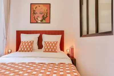 Un ou plusieurs lits dans un hébergement de l'établissement Charming& cozy flat - Montmartre Sacré Coeur