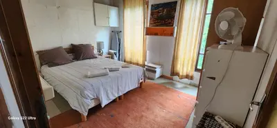 Un ou plusieurs lits dans un hébergement de l'établissement Montmartre relax