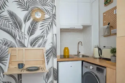Cuisine ou kitchenette dans l'établissement Studio resplendissant près de Montmartre