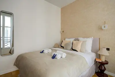Un ou plusieurs lits dans un hébergement de l'établissement Luxurious and tranquil studio - Opéra - AC