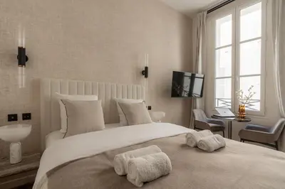 Un ou plusieurs lits dans un hébergement de l'établissement Luxurious and quiet studio - Opéra - Air conditioning