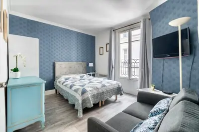 Un ou plusieurs lits dans un hébergement de l'établissement Appartement Montmartre Sacré-Cœur