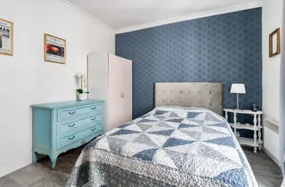 Un ou plusieurs lits dans un hébergement de l'établissement Appartement Montmartre Sacré-Cœur