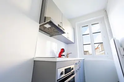 Cuisine ou kitchenette dans l'établissement 1 Chambre rue du 14 juillet