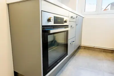 Cuisine ou kitchenette dans l'établissement 1 Chambre rue du 14 juillet