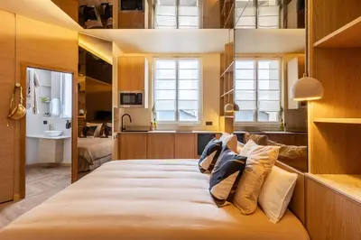 Un ou plusieurs lits dans un hébergement de l'établissement Studio moderne tout confort aux portes de Paris à Saint-Ouen