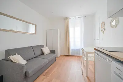 Coin salon dans l'établissement Appartement Cosy Neuf