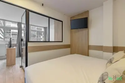 Un ou plusieurs lits dans un hébergement de l'établissement Appartement pour 4 - Parc Expo P de Versailles