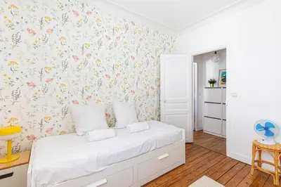 Un ou plusieurs lits dans un hébergement de l'établissement GuestReady - Charming Nest near Paris