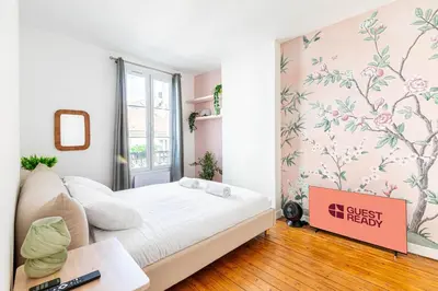Un ou plusieurs lits dans un hébergement de l'établissement GuestReady - Charming Nest near Paris