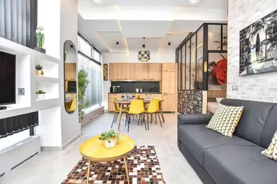 Coin salon dans l'établissement Superb apartment 3BR 8P - Nation