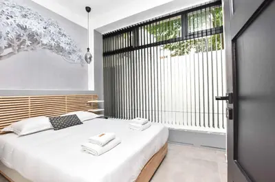 Un ou plusieurs lits dans un hébergement de l'établissement Superb apartment 3BR 8P - Nation