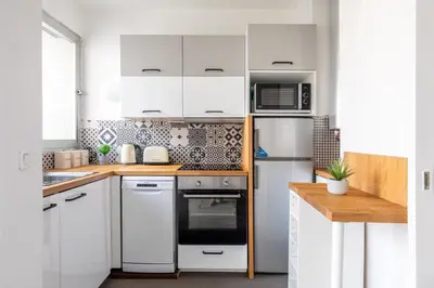 Cuisine ou kitchenette dans l'établissement Appartement Élégant au Cœur du 16e Arrondissement