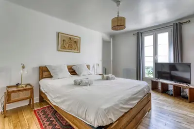 Télévision ou salle de divertissement dans l'établissement Appartement Choiseul - Welkeys