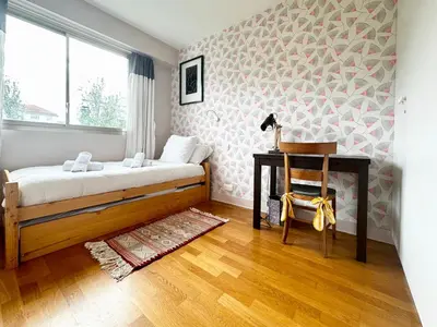 Un ou plusieurs lits dans un hébergement de l'établissement Le Bellevue - appartement raffiné proche Paris