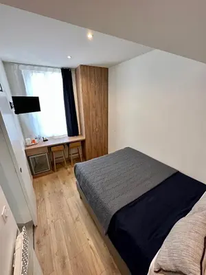 Un ou plusieurs lits dans un hébergement de l'établissement Hotel Zora