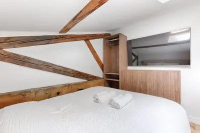 Un ou plusieurs lits dans un hébergement de l'établissement Mykeypers Luxury and Design Loft 2BR 6P with AC Bastille