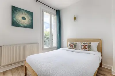 Un ou plusieurs lits dans un hébergement de l'établissement Mykeypers - Charmant studio 2P - Malakoff 13