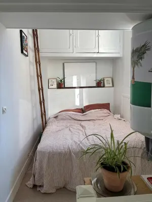 Un ou plusieurs lits dans un hébergement de l'établissement Cosy apartment - Bon Marché