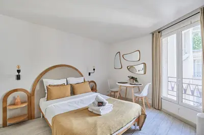Un ou plusieurs lits dans un hébergement de l'établissement Modern Suite Champs Elysées Trocadero by SP