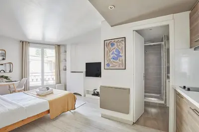 Un ou plusieurs lits dans un hébergement de l'établissement Modern Suite Champs Elysées Trocadero by SP