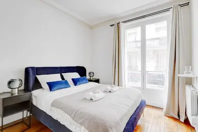 Un ou plusieurs lits dans un hébergement de l'établissement Suite Chapu - Cocon au cœur du 16e arrondissement