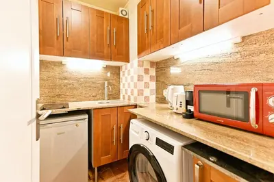 Cuisine ou kitchenette dans l'établissement Élégant bien situé votre havre de paix à Paris-II