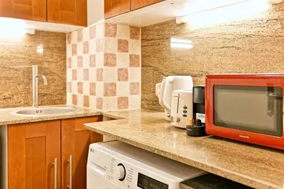 Cuisine ou kitchenette dans l'établissement Élégant bien situé votre havre de paix à Paris-II