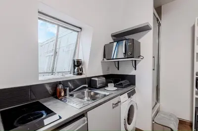 Cuisine ou kitchenette dans l'établissement Studio Faubourg Poissonnière