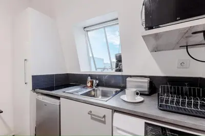 Cuisine ou kitchenette dans l'établissement Studio Faubourg Poissonnière