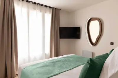 Un ou plusieurs lits dans un hébergement de l'établissement Superb air-conditioned apartment Paris Le Marais