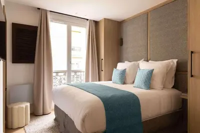 Un ou plusieurs lits dans un hébergement de l'établissement Superb air-conditioned apartment Paris Le Marais