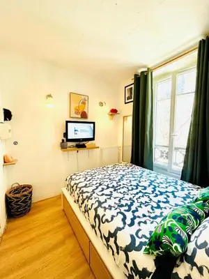 Un ou plusieurs lits dans un hébergement de l'établissement Studio 17ème Batignolles