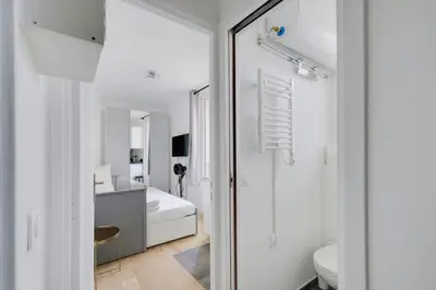 Un ou plusieurs lits dans un hébergement de l'établissement Charming studio L028