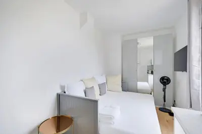 Un ou plusieurs lits dans un hébergement de l'établissement Charming studio L028