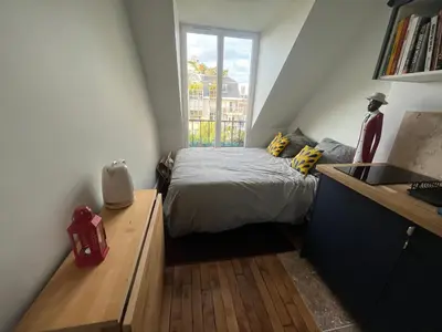 Un ou plusieurs lits dans un hébergement de l'établissement Appartement 8 personnes - terrasse sur espaces verts - vue Tour Eiffel