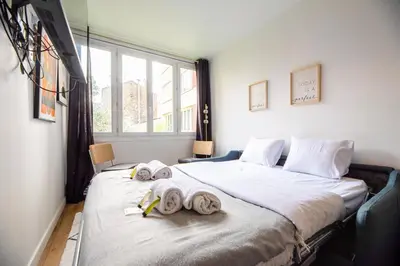 Un ou plusieurs lits dans un hébergement de l'établissement Studio near Bois de Vincennes