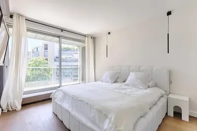 Un ou plusieurs lits dans un hébergement de l'établissement Paris 16e Prestige & Charme