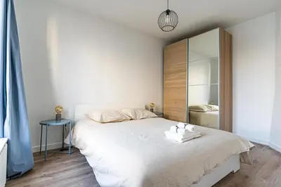 Un ou plusieurs lits dans un hébergement de l'établissement Stylish Getaway in Boulogne I Quick Paris Access